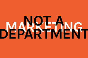 "Marketing is not a department" typographic headline
